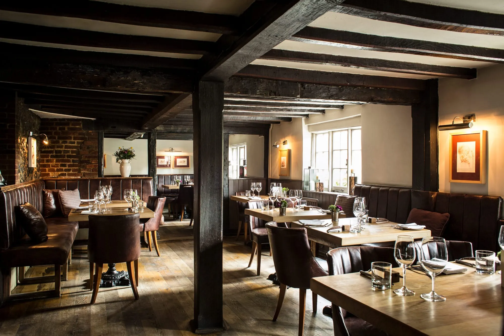 The oak-beamed dining room at The Hand and Flowers in Marlow.