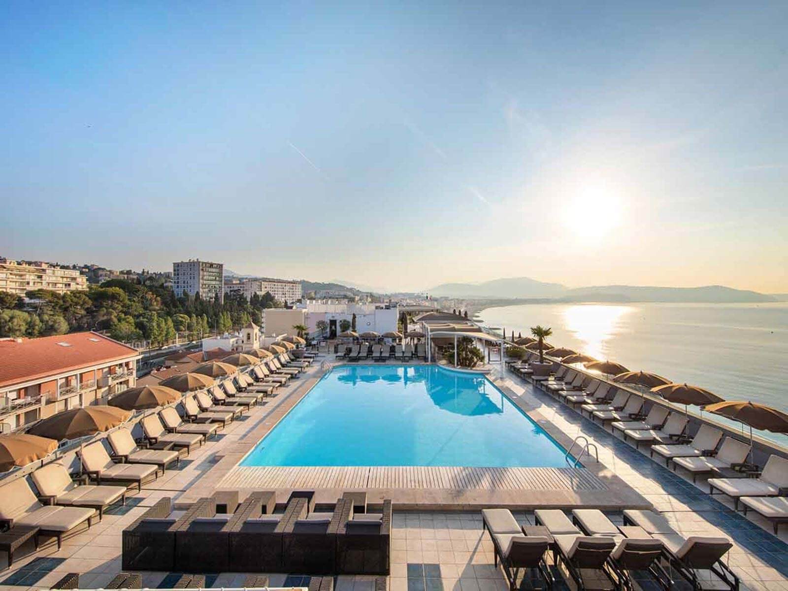 Image of the large outdoor pool on a terrace overlooking the sea