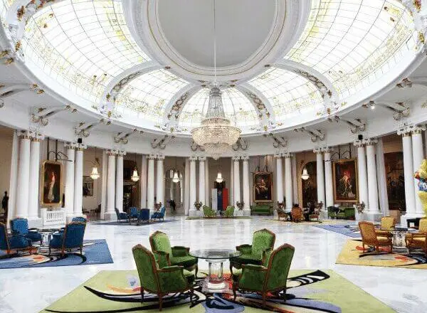 The main lobby in Le Negresco hotel filled with beautiful portraits and statues