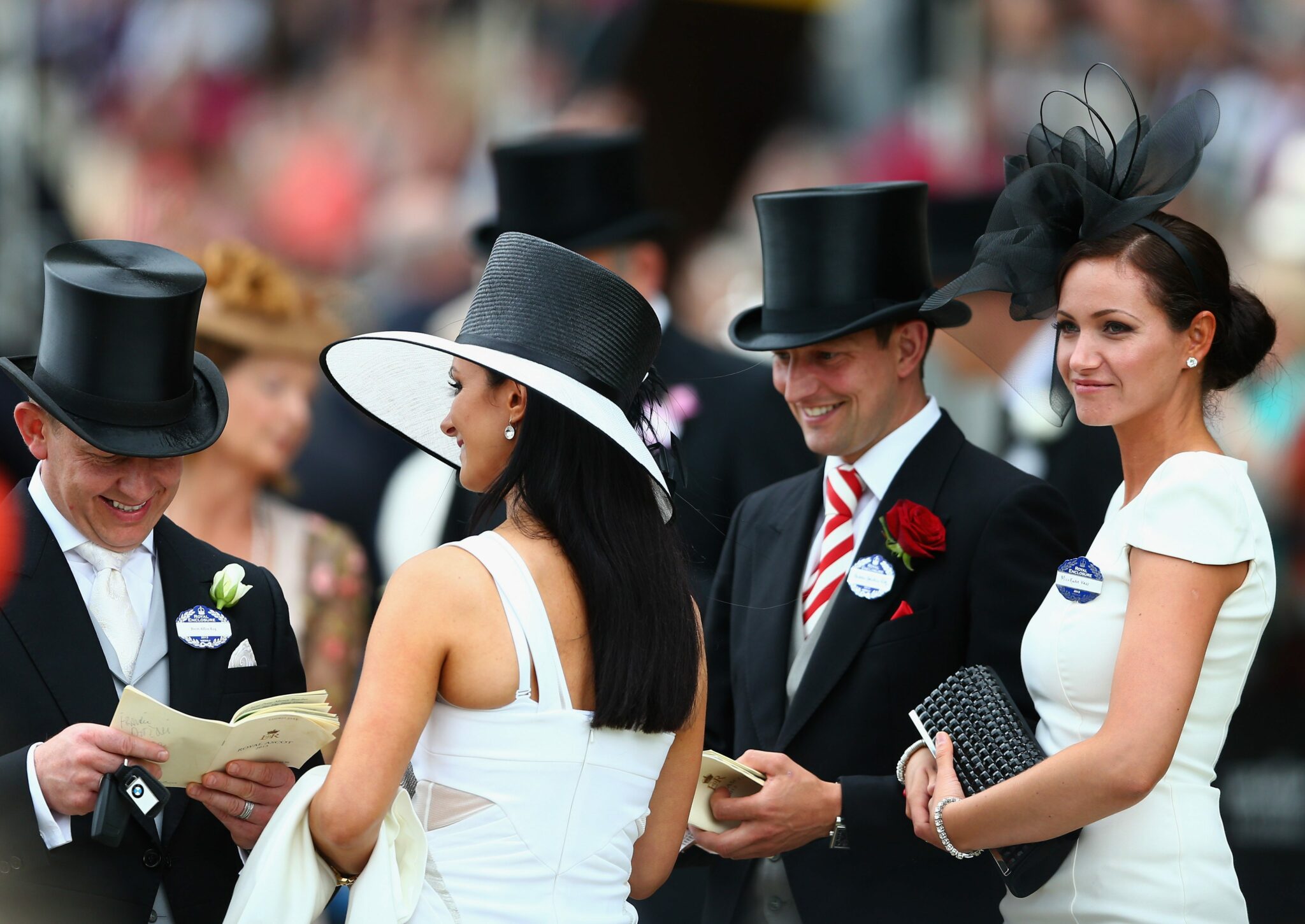 Image of guests dressed in formal wear and top hats