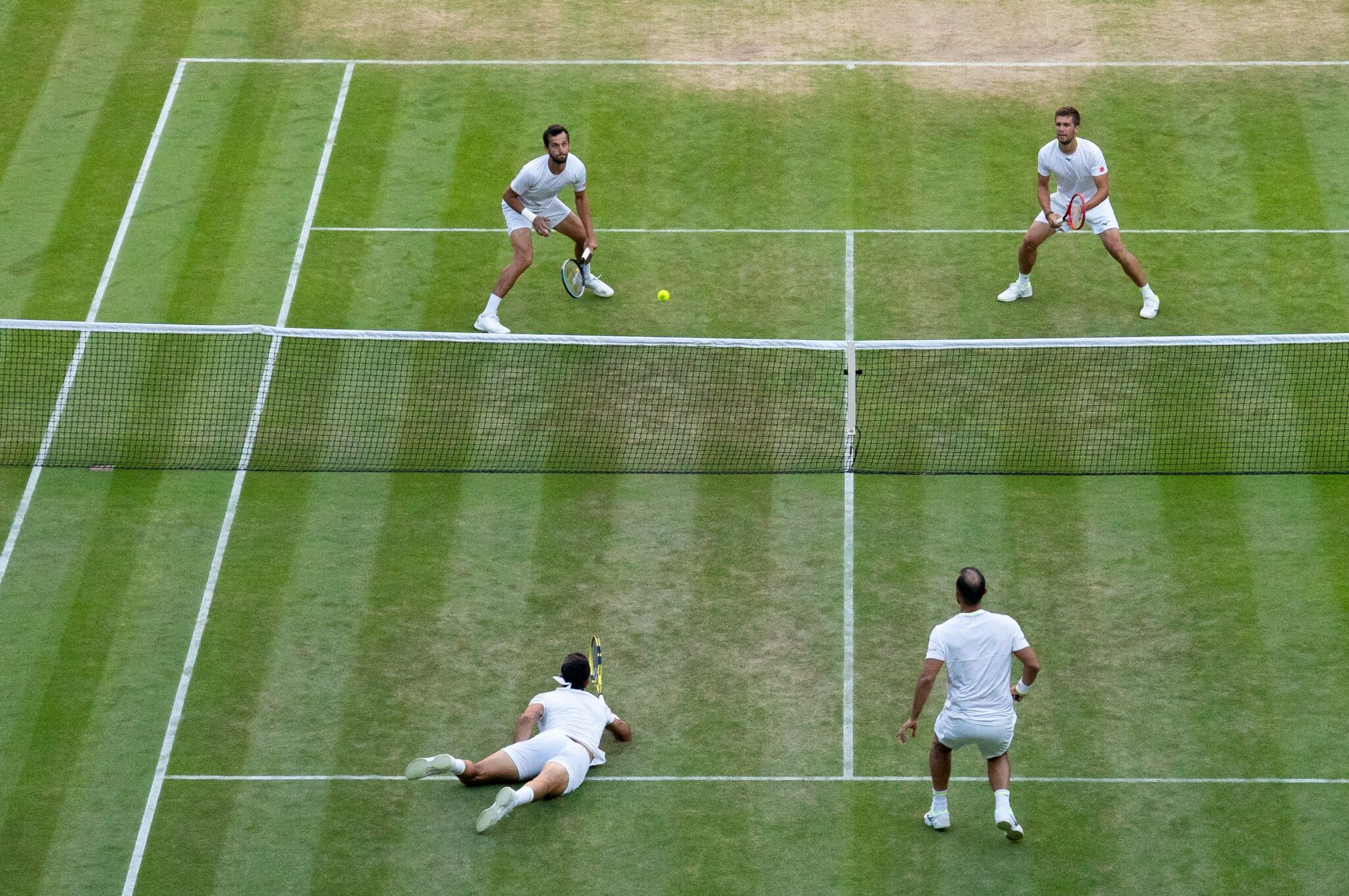 Image of a doubles tennis match at Wimbledon