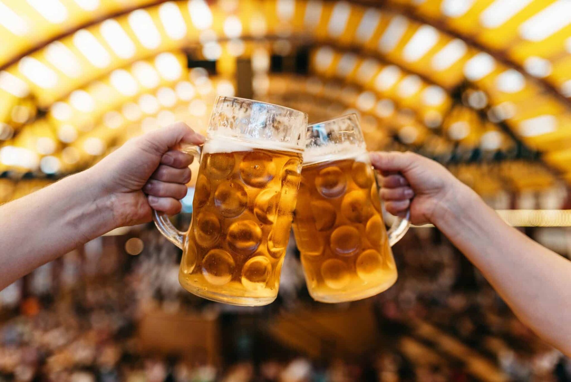 Beer glasses clinking together