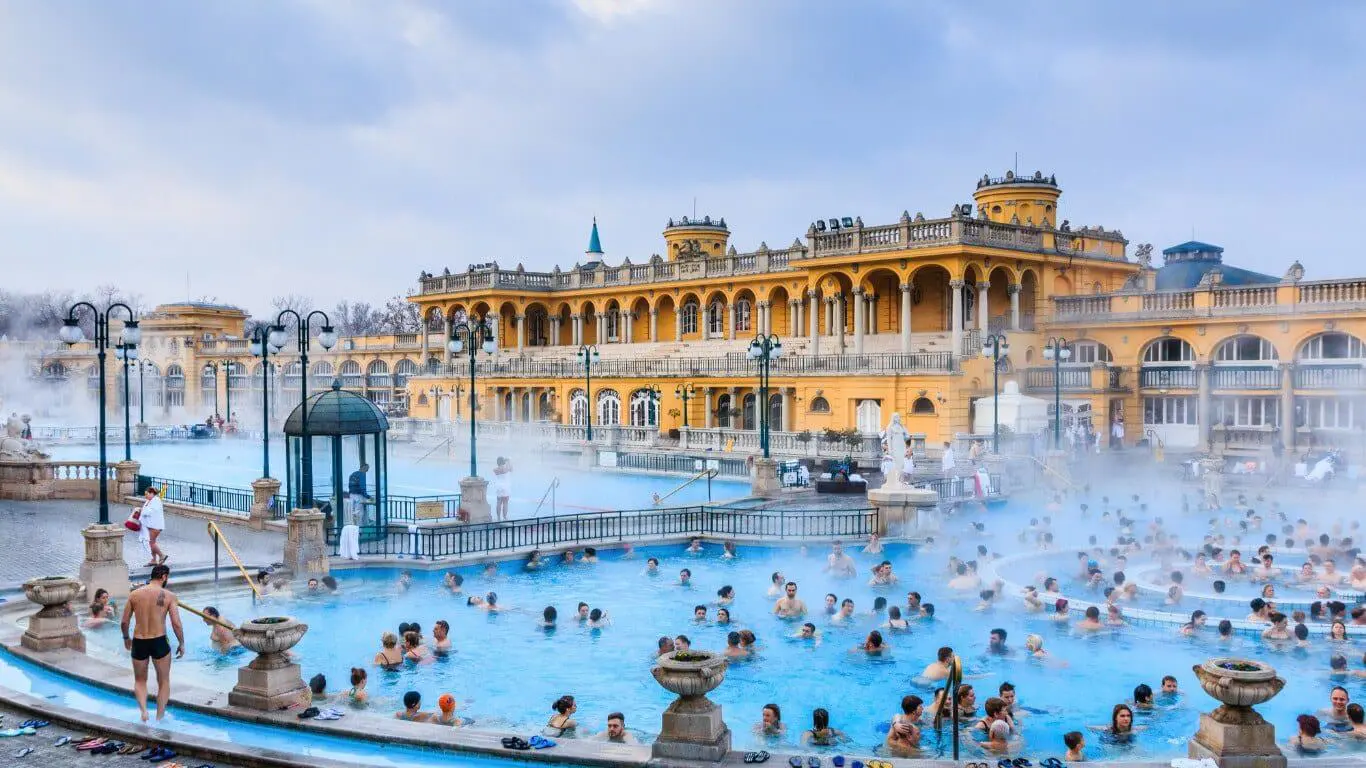 Image of the thermal outdoor baths in budapest with people bathing