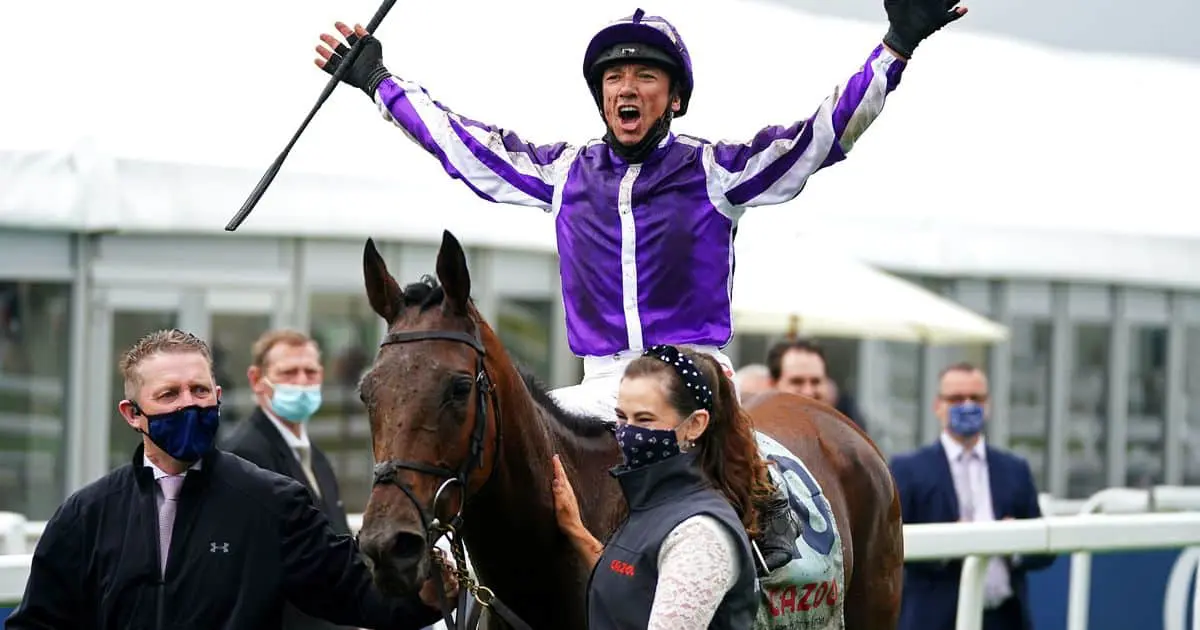 image of a jockey shouting in joy after winning a race