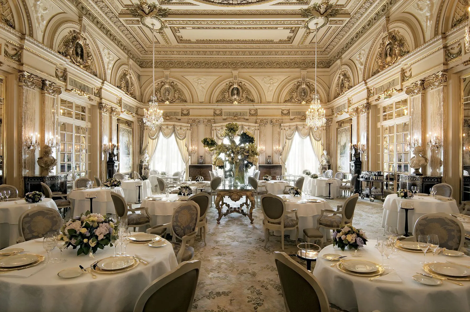 Image of the luxurious dining area in the Hotel de Paris Monte-Carlo with tables laid for service