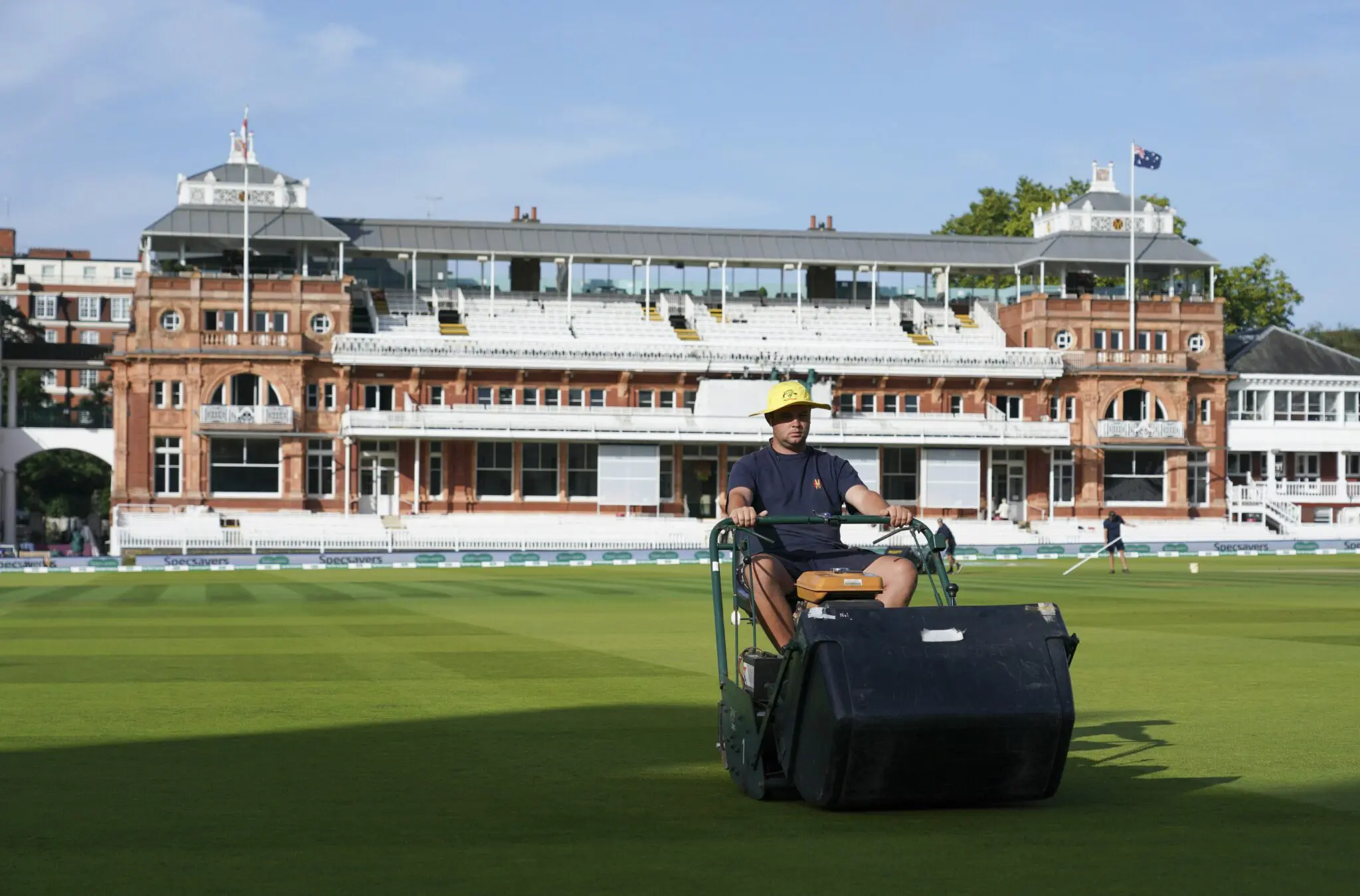 Gardener on the lawn on the Cricket ground