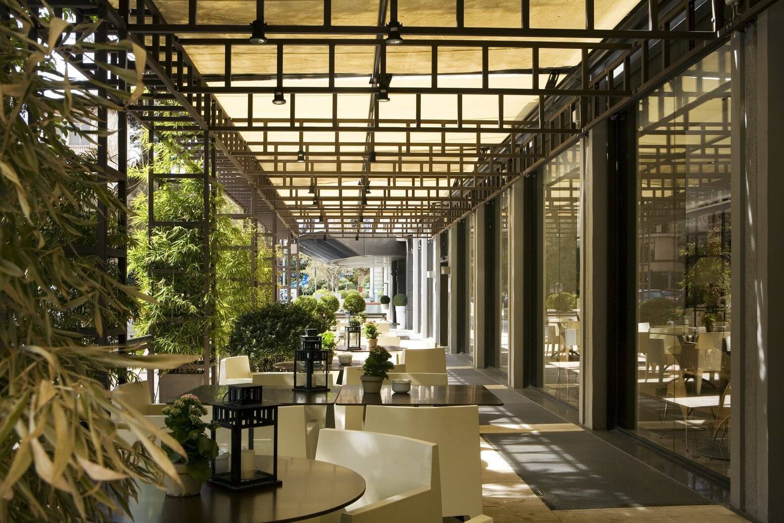 Image of the hotel's outdoor seating area, under coverr
