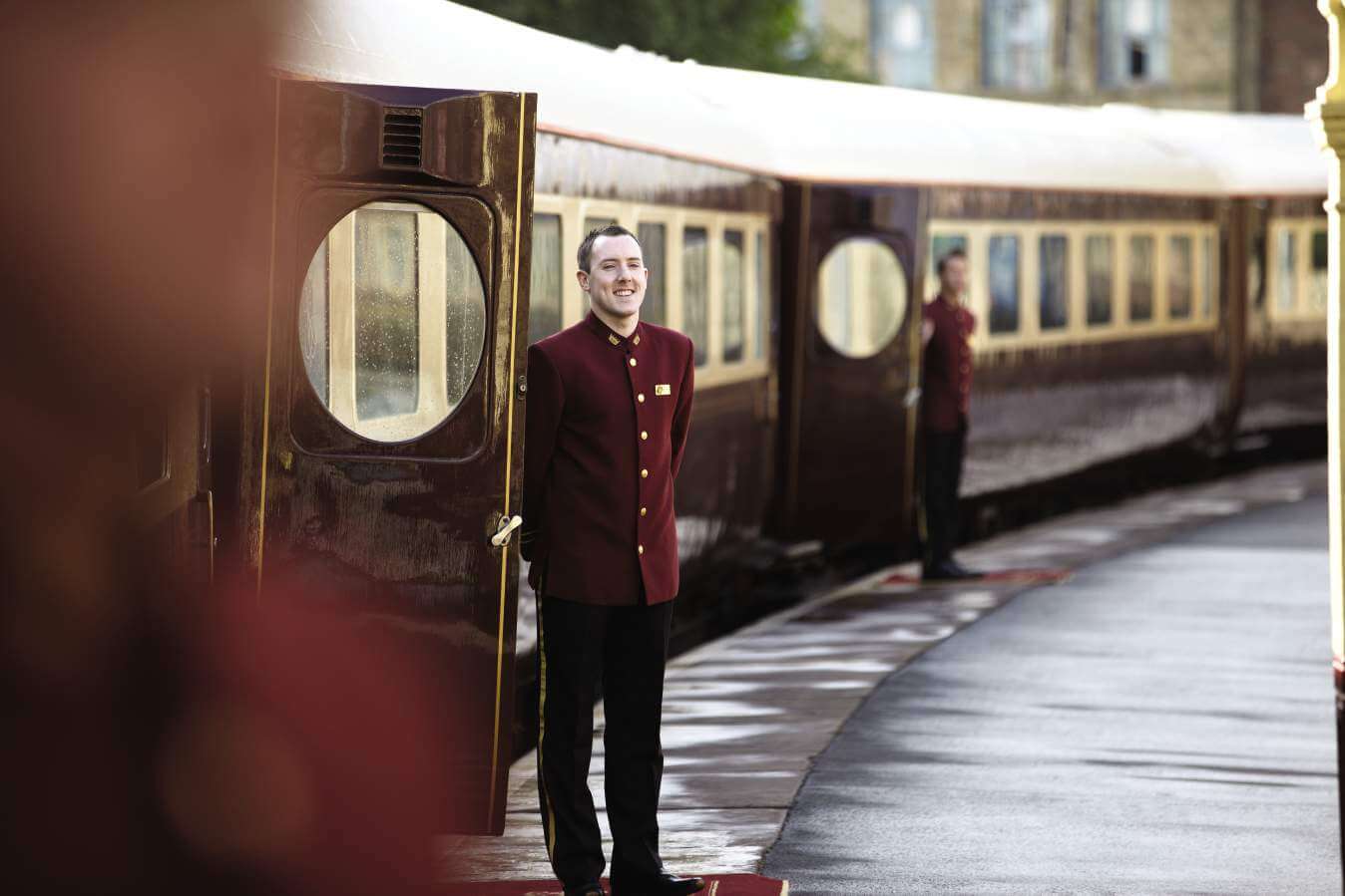 Image of train conductor on the platform outside of the Northern Belle
