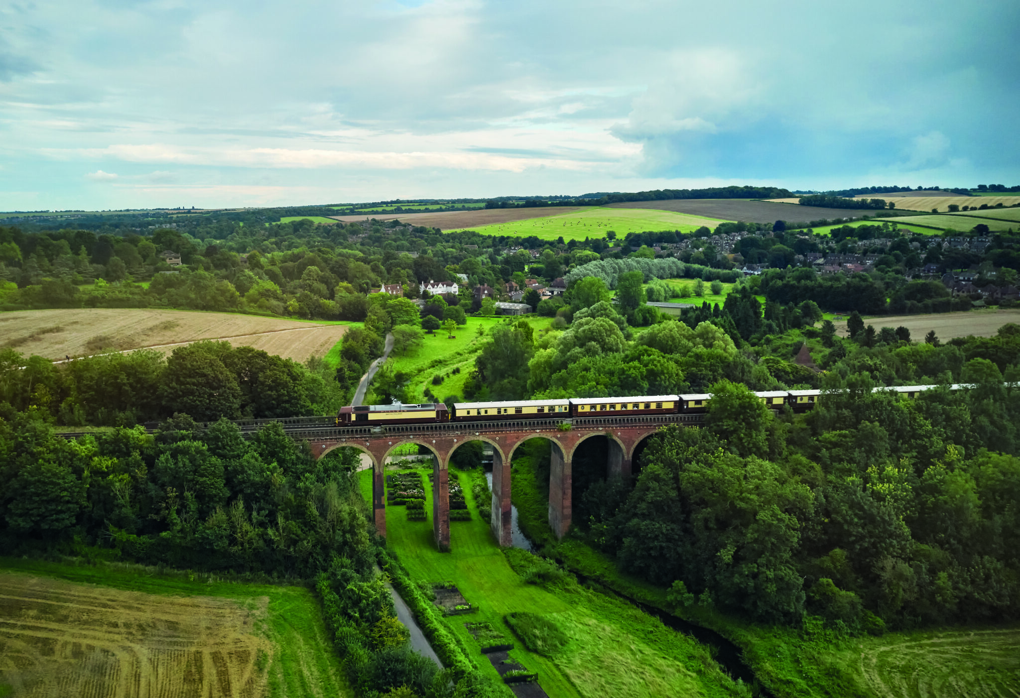 The British Pullman crossing through the British Countryside
