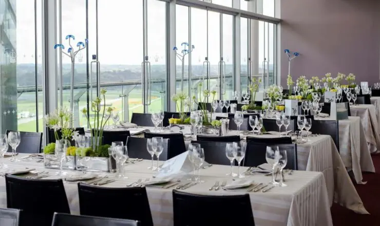 Image of table laid for service in the panoramic restaurant overlooking the race track