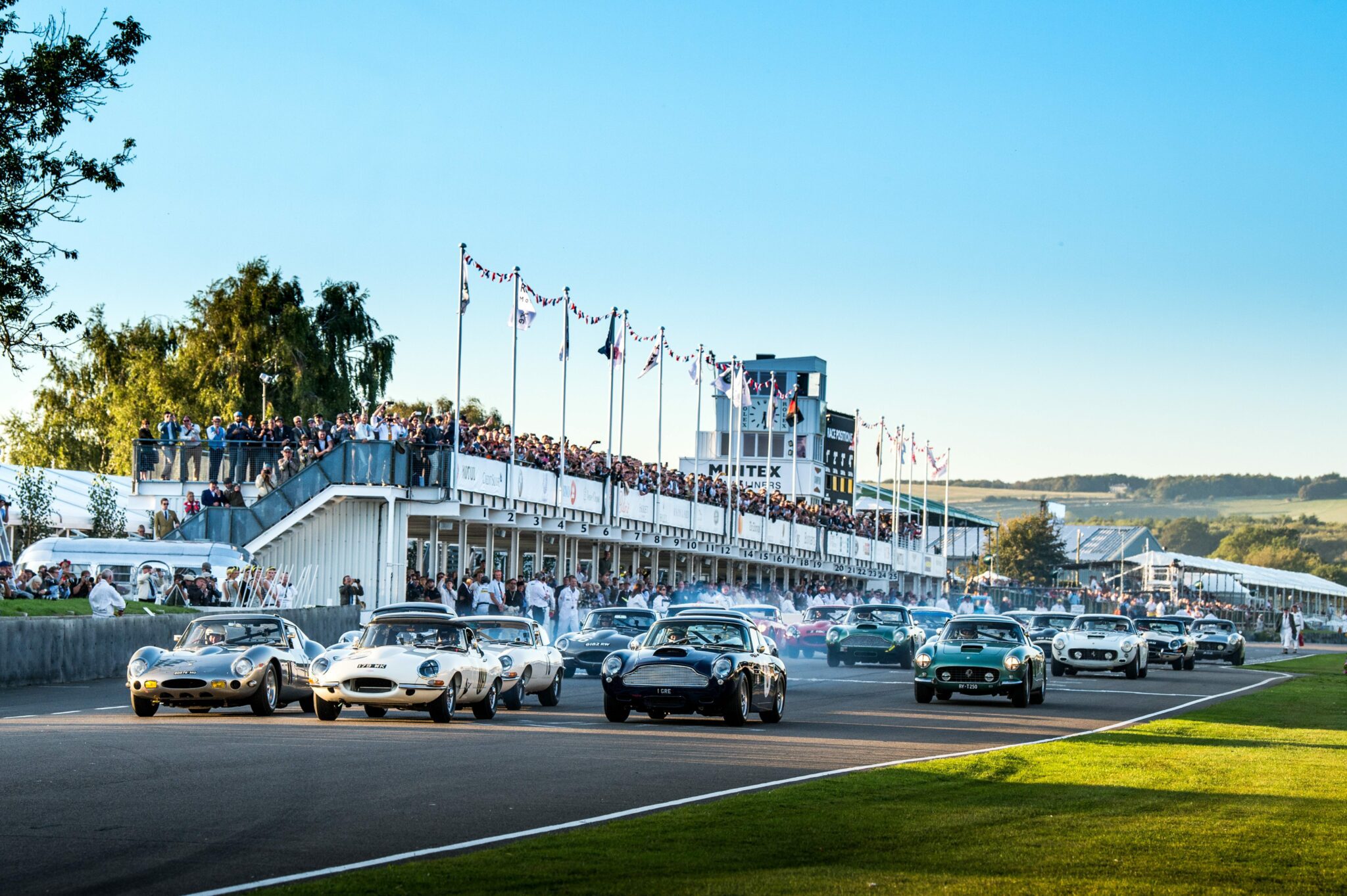 Cars racing on the racetrack at Goodwood