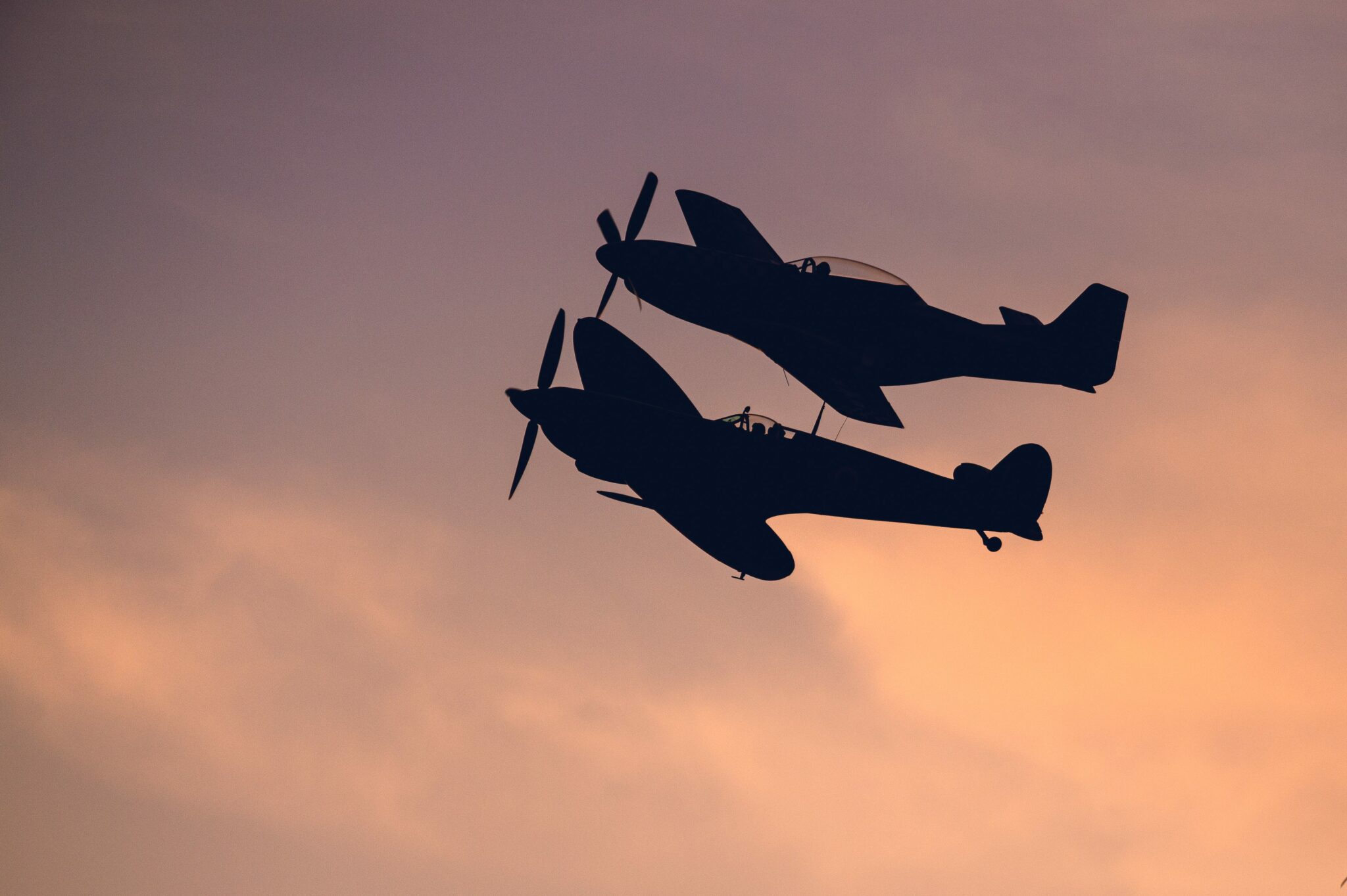 Aircraft flying at sunset over Goodwood