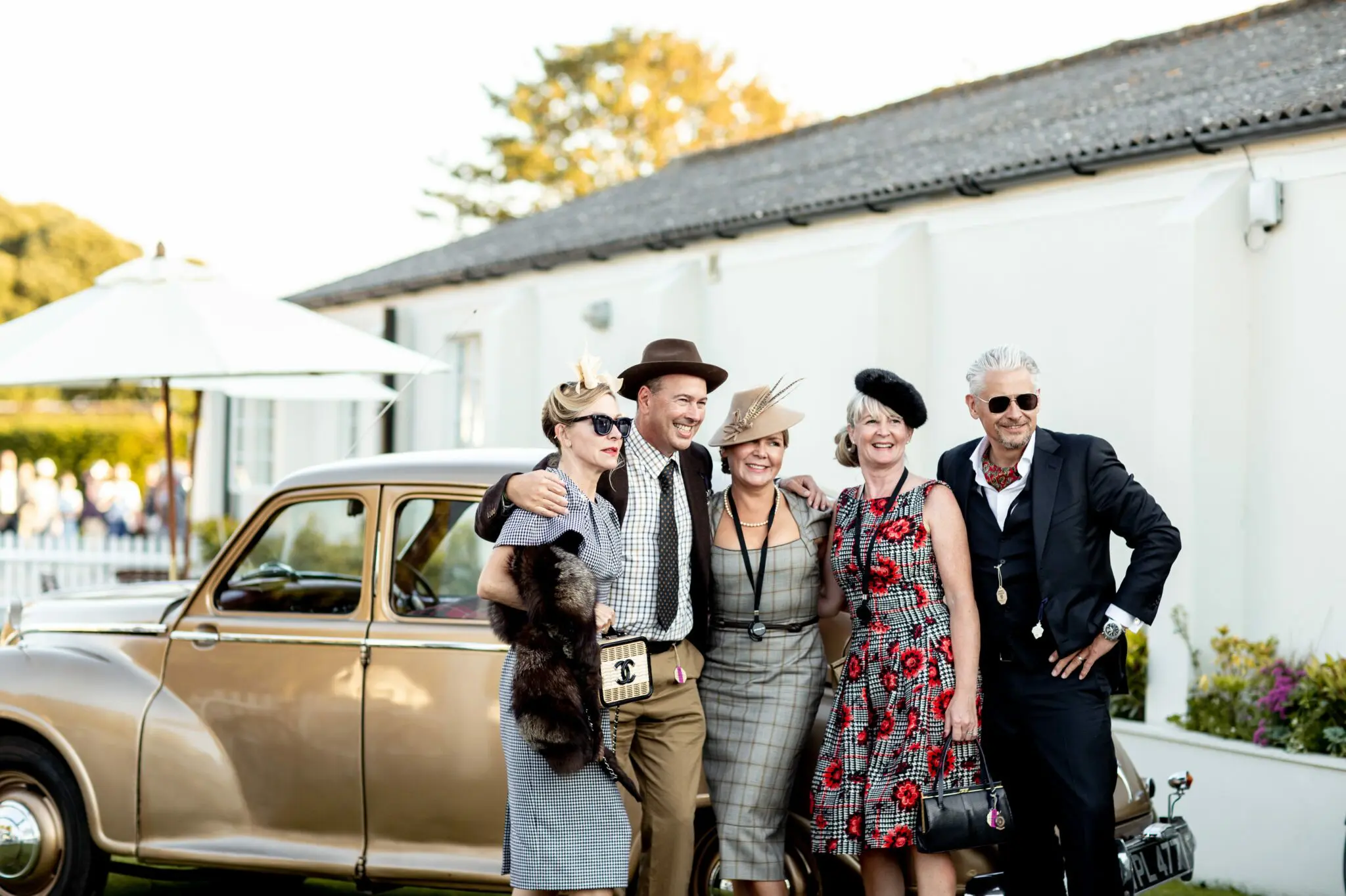 Guests dressed up in vintage attire posing for a photo