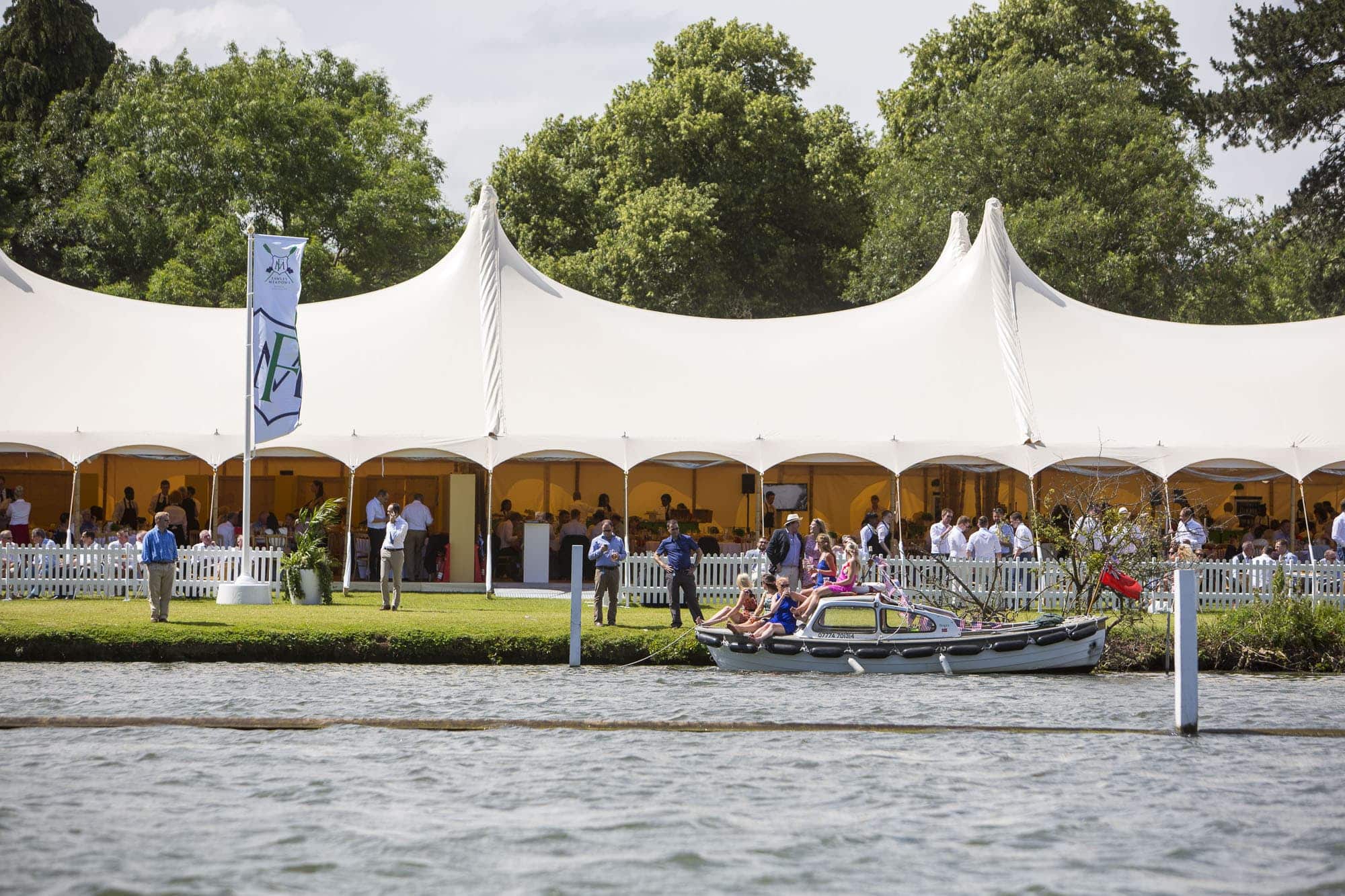 River boat on Thames infront of marquee