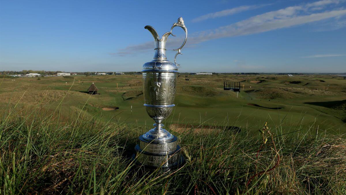 The Open trophy placed on grass on the golf course