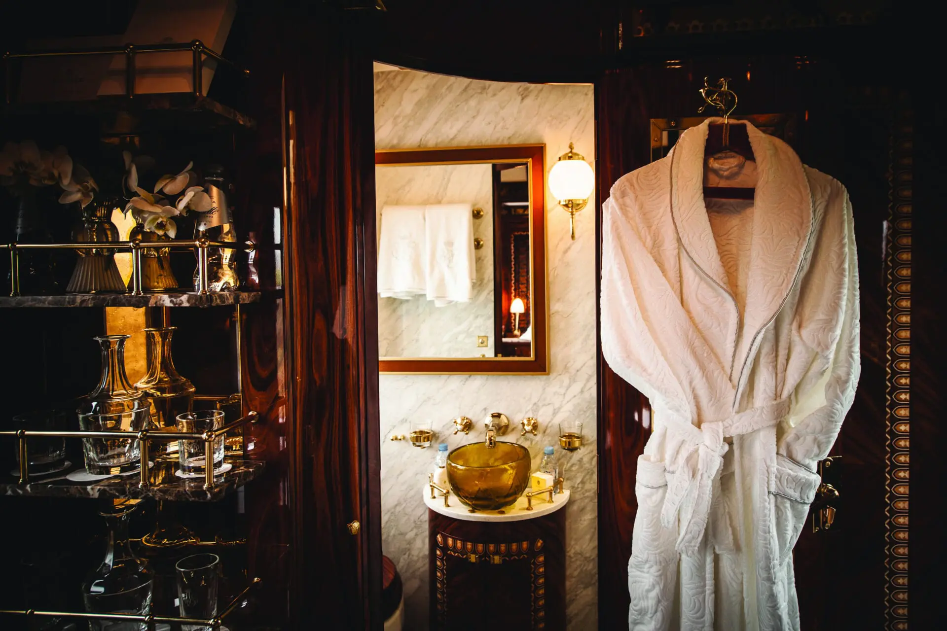 image of a bath robe hanging up and bathroom on the venice simplon orient express