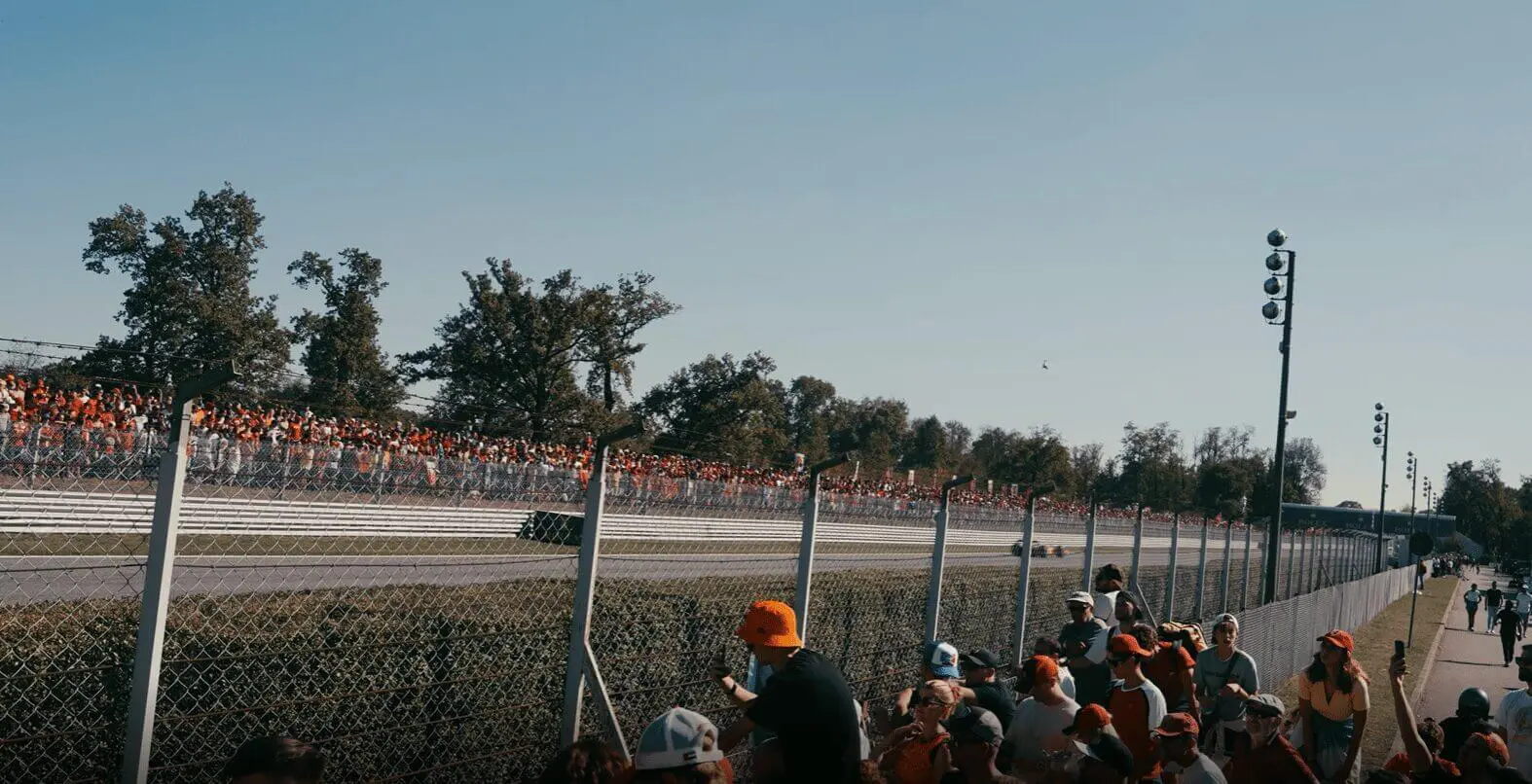 Image of crowds gathering around the side of the racetrack