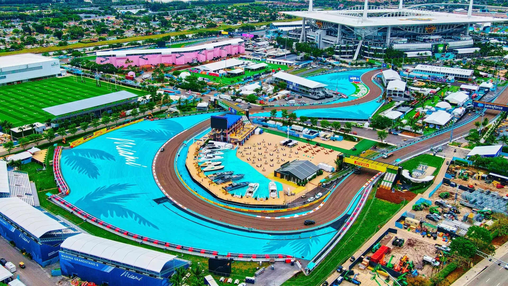 The Miami Grand Prix race track from above feautring a bright blue race track and plenty of greenery