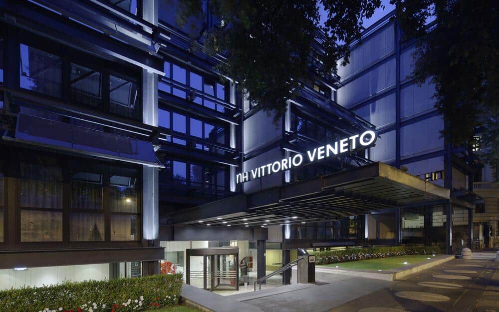 Image of the hotel NH Collection Roma Vittorio Veneto from outside at night